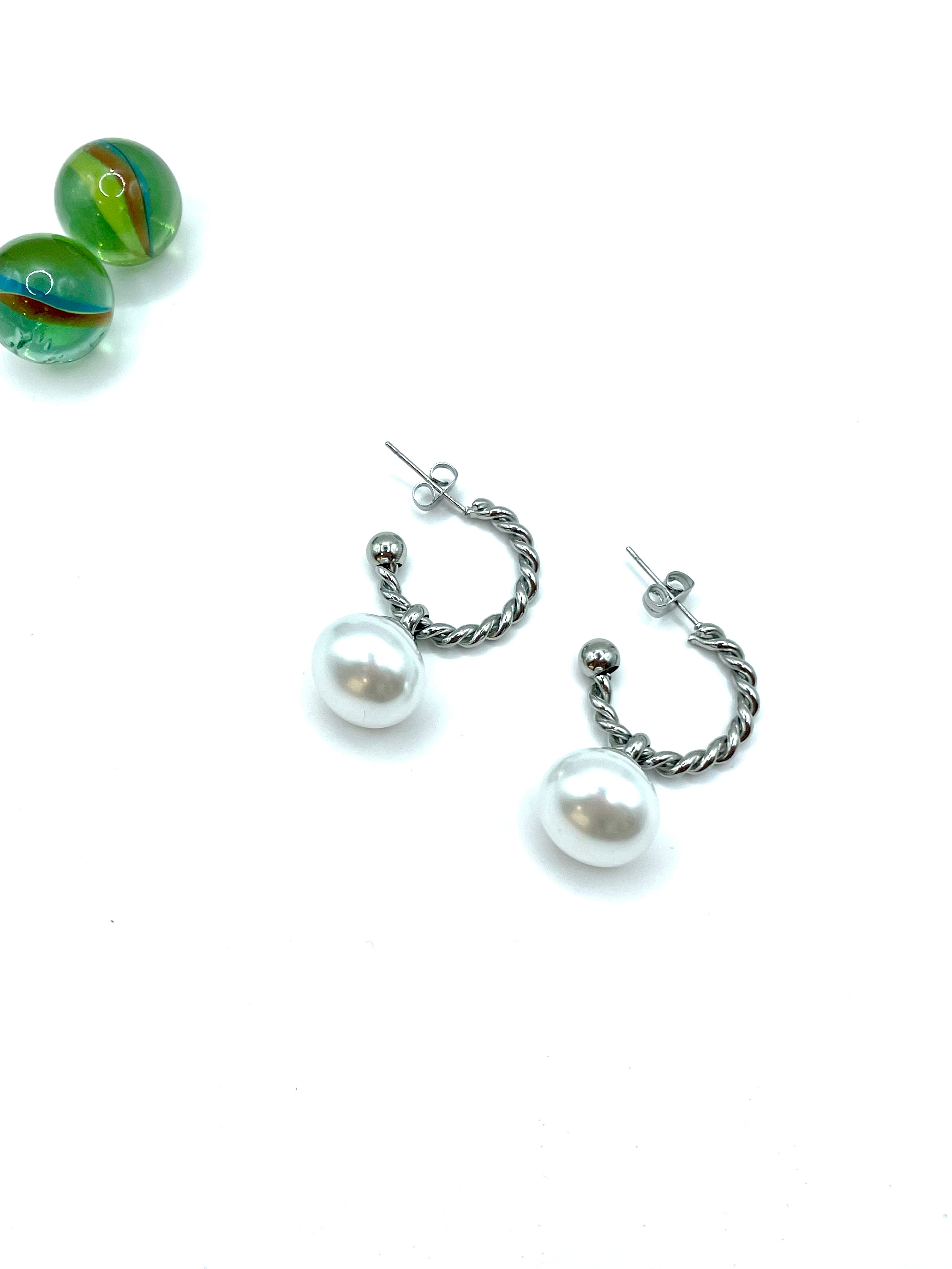 “Braided hoops big pearl” earrings