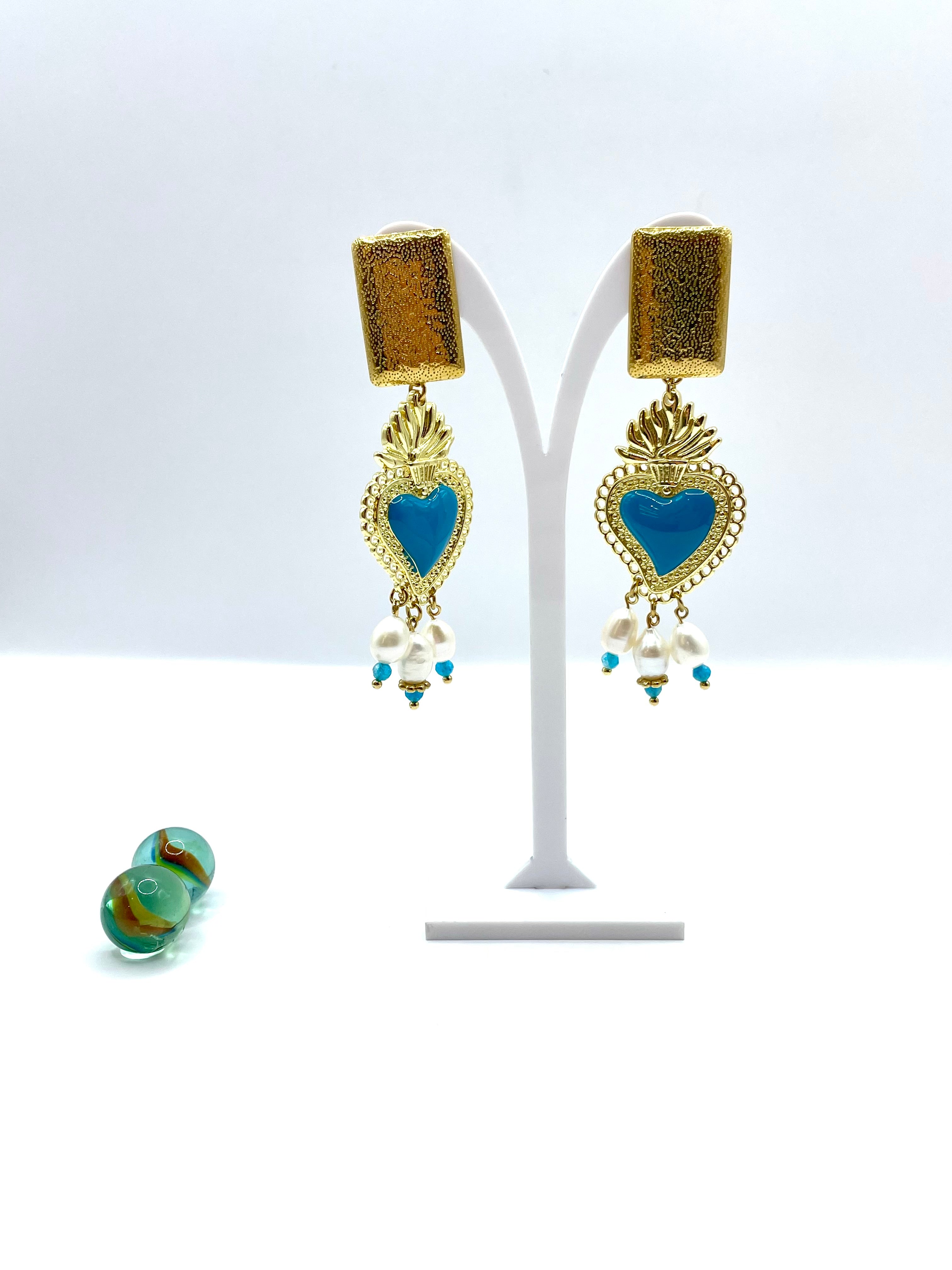 “Turquoise flaming heart” dangle earrings